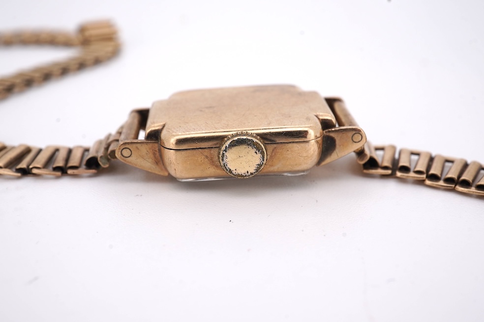 A lady's 1950's 9ct gold Tudor manual wind wrist watch, with Arabic dial, case diameter 18mm, on a damaged 9ct gold bracelet, gross weight 18.6 grams, together with a lady's 18ct gold Buren manual wind wrist watch, on a